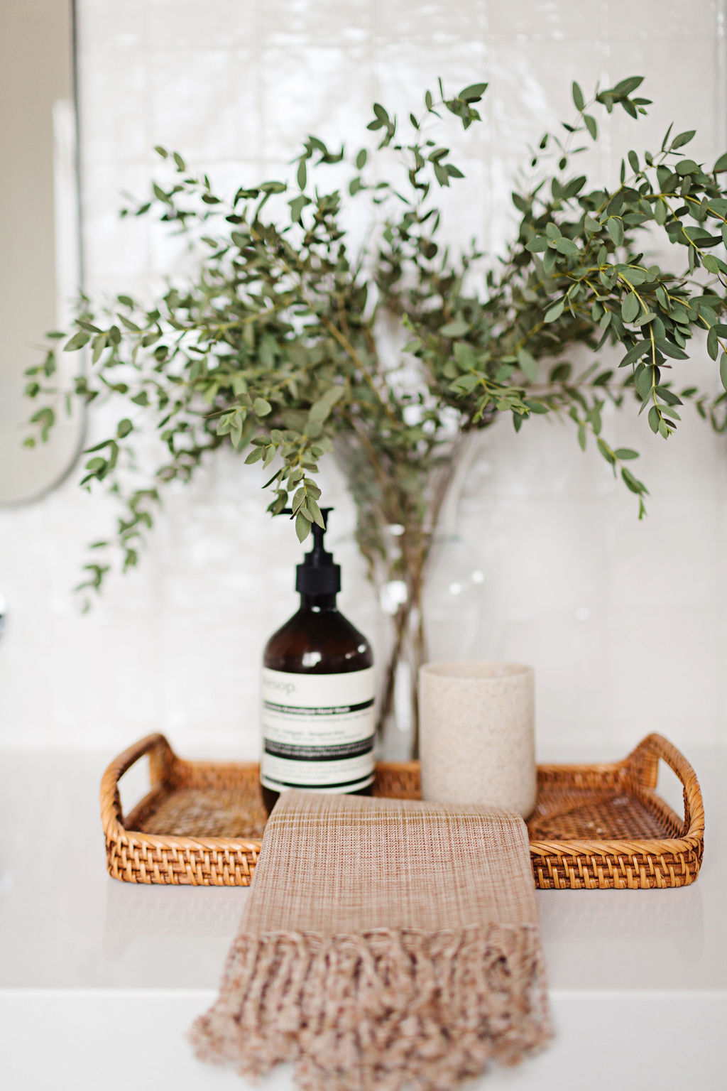 bathroom styling, vanity styling, olive branches, wicker tray
